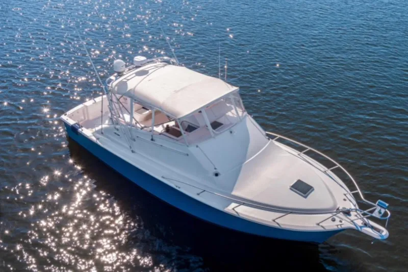The Image of 2001 Ocean Yachts 40 Express Bridge on sparkling water. - 0