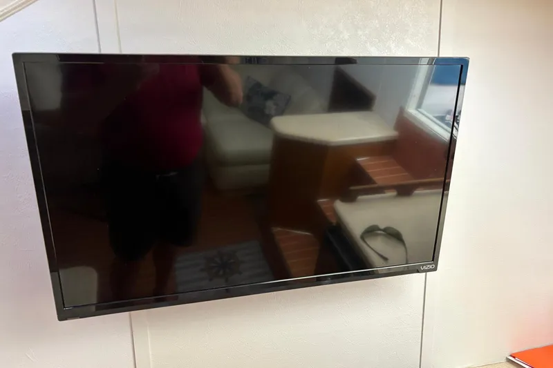 Slide: The Image of Flat-screen TV inside 2001 Ocean Yachts 40 Super Sport, reflecting interior furnishings. - 10
