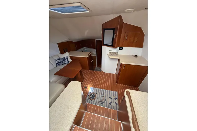 Slide: The Image of Interior of 2001 Ocean Yachts 40 Super Sport with wood flooring and modern furnishings. - 11