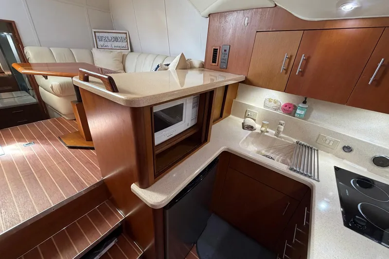 Slide: The Image of Luxurious kitchen interior of 2001 Ocean Yachts 40 Super Sport with modern amenities. - 13