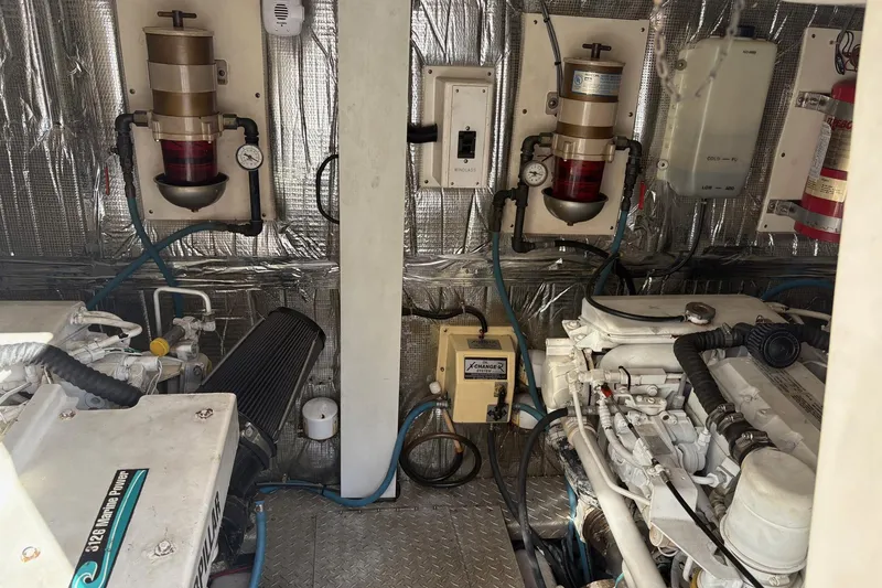 Slide: The Image of Engine room of 2001 Ocean Yachts 40 Super Sport with visible machinery and equipment. - 25