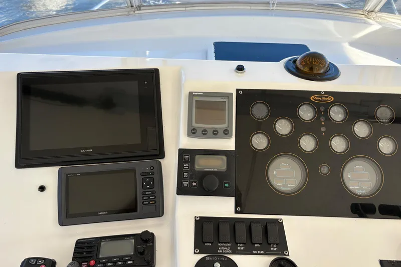 Slide: The Image of Control panel of a 2001 Ocean Yachts 40 Super Sport with navigation instruments. - 3