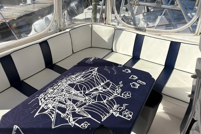 Slide: The Image of Interior of 2001 Ocean Yachts 40 Super Sport with nautical-themed table cover. - 6