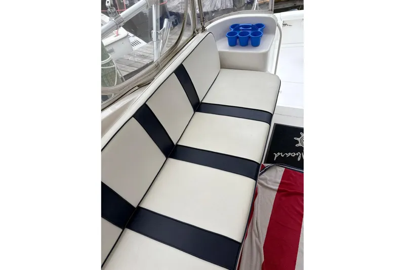 Slide: The Image of Luxurious seating on 2001 Ocean Yachts 40 Super Sport with cup holders and nautical decor. - 7
