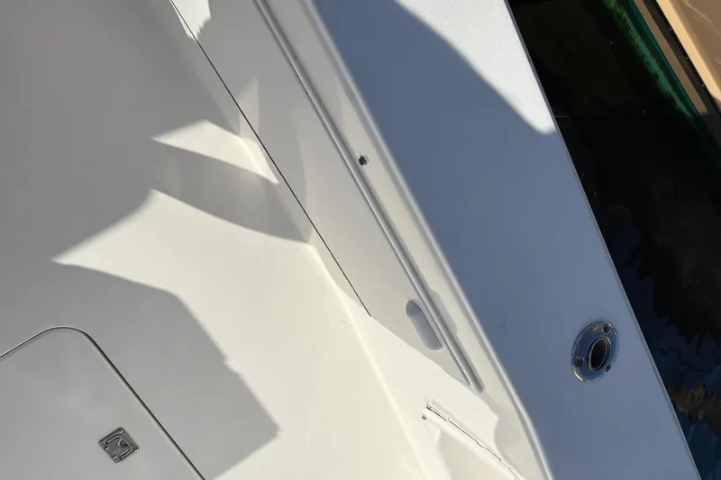 Slide: The Image of Close-up of 2001 Ocean Yachts 40 Super Sport deck with shadows and fittings. - 8