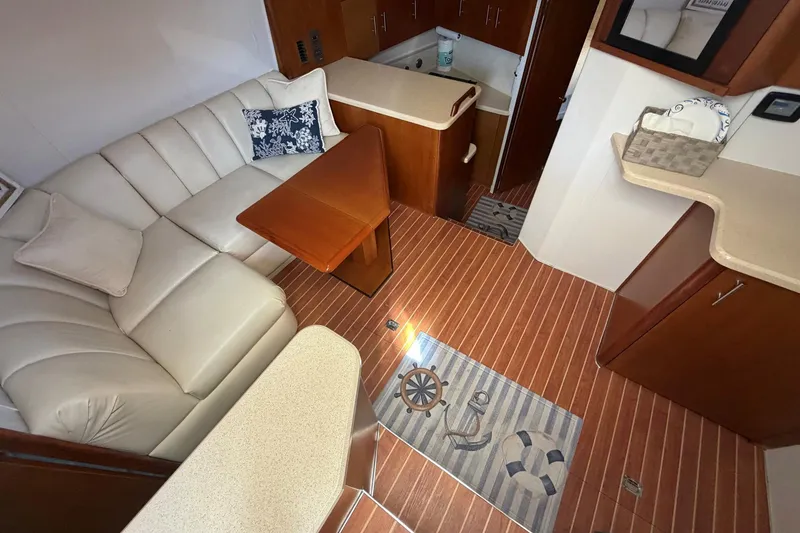 Slide: The Image of Interior of 2001 Ocean Yachts 40 Super Sport with leather seating and wooden accents. - 9