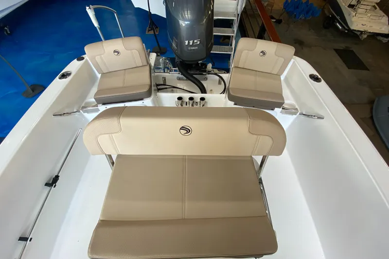 Slide: The Image of 2024 Edgewater 170CC Center Console boat interior with seating and 115 HP engine. - 6