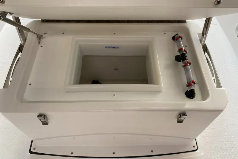 Slide: The Image of 2024 Edgewater 170CC Center Console livewell and storage compartment. - 7