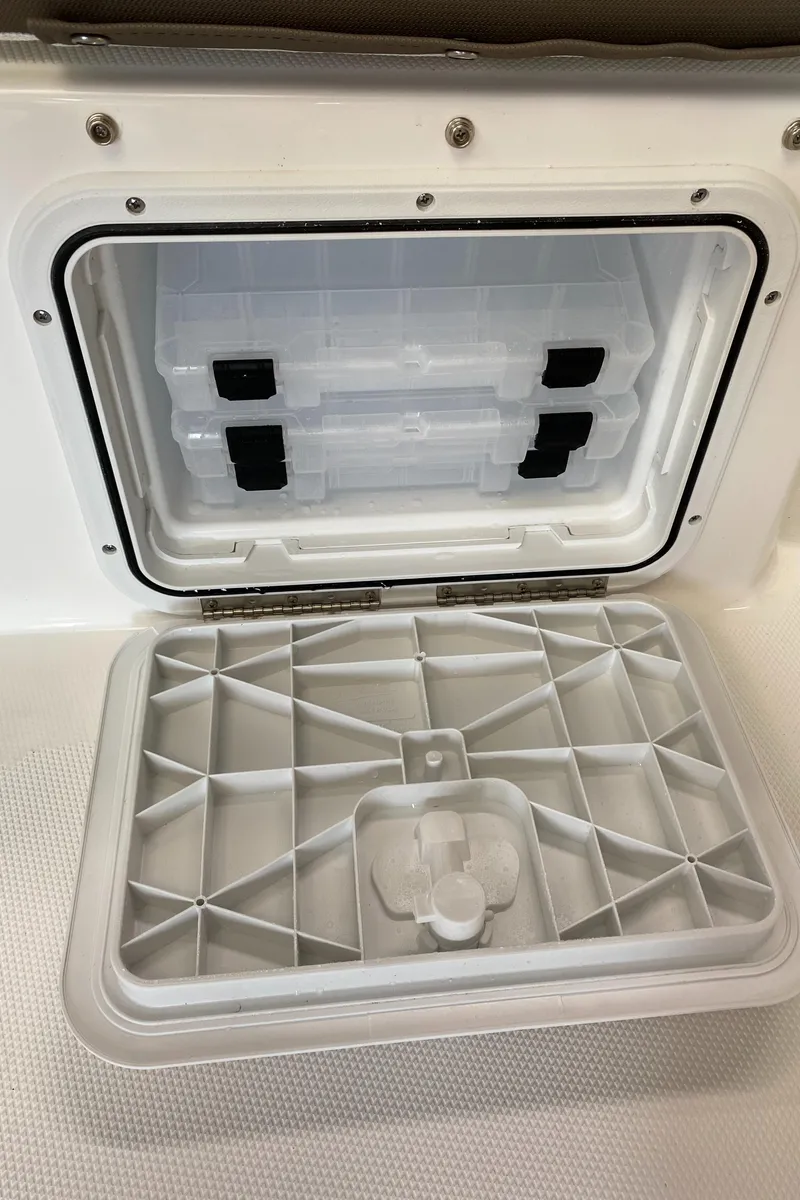 Slide: The Image of 2024 Edgewater 170CC Center Console storage compartment with open hatch. - 8