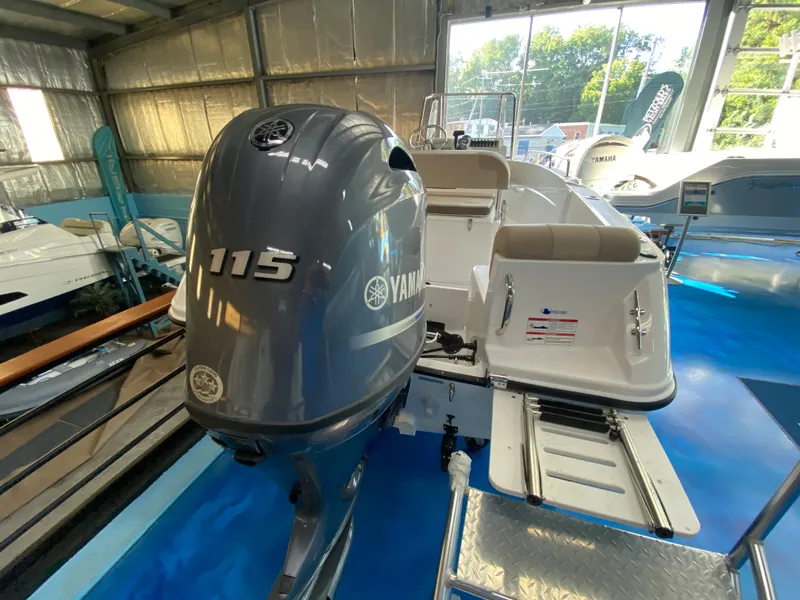 Slide: The Image of 2024 Edgewater 170CC Center Console boat with Yamaha 115 outboard motor in showroom. - 9