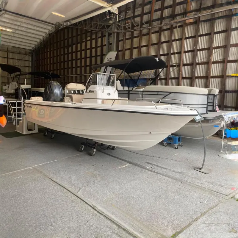 The Image of 2024 Edgewater 188CC Center Console boat in a showroom. - 0