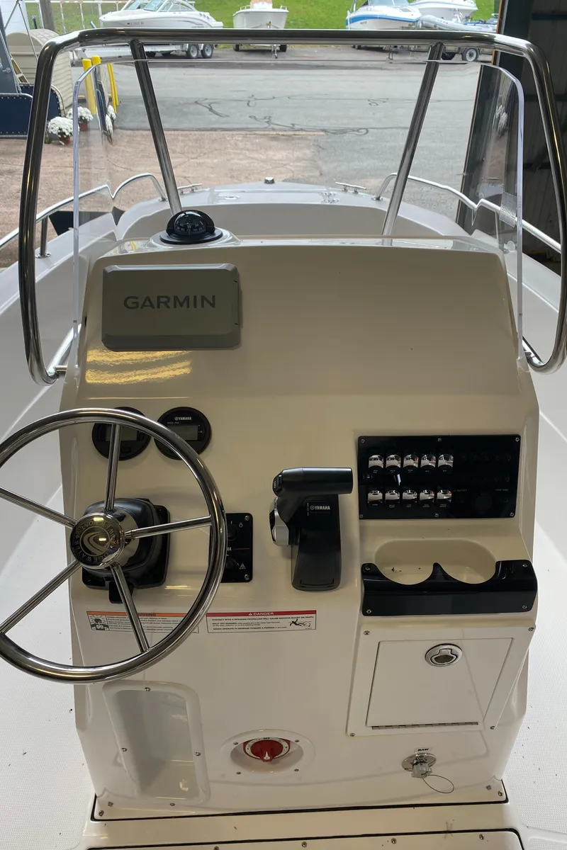 Slide: The Image of 2024 Edgewater 188CC Center Console boat dashboard with Garmin navigation system. - 4