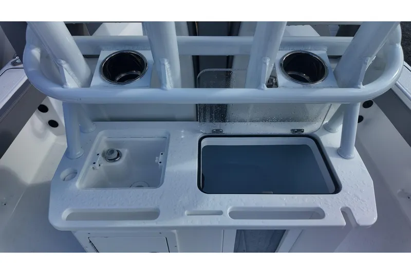 Slide: The Image of 2026 Blazer Bay Makaira 2800 boat console with cup holders and storage compartments. - 15