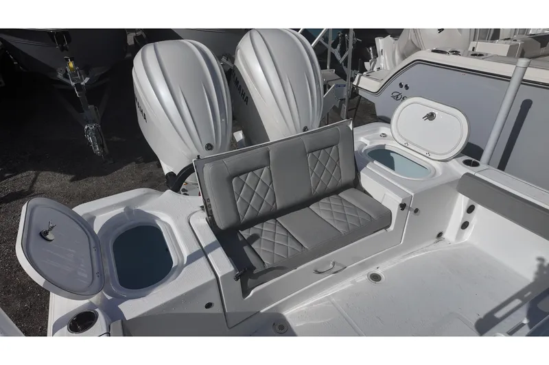 Slide: The Image of 2026 Blazer Bay Makaira 2800 boat interior with dual Yamaha engines and seating. - 16