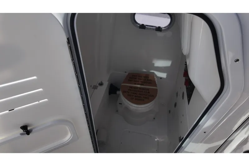 Slide: The Image of 2026 Blazer Bay Makaira 2800 boat interior cabin with compact toilet. - 17