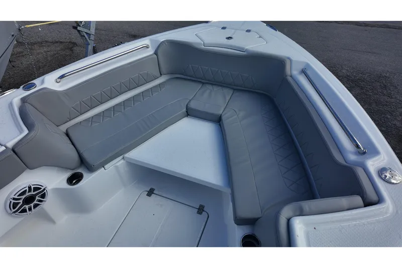 Slide: The Image of 2026 Blazer Bay Makaira 2800 boat interior with gray cushioned seating and speaker. - 19