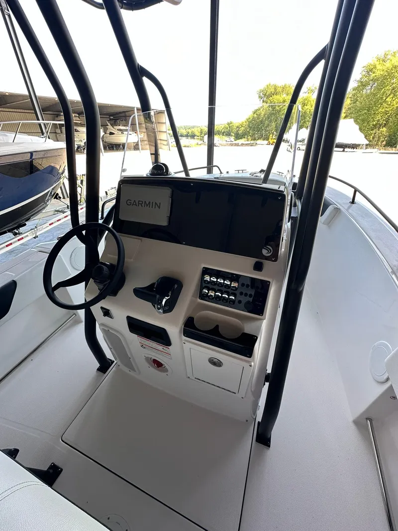 Slide: The Image of 2025 Edgewater 208CC Center Console boat interior with Garmin navigation system. - 13