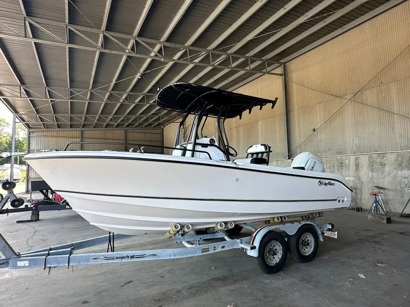 Slide: The Image of 2025 Edgewater 208CC Center Console boat on trailer in warehouse. - 3