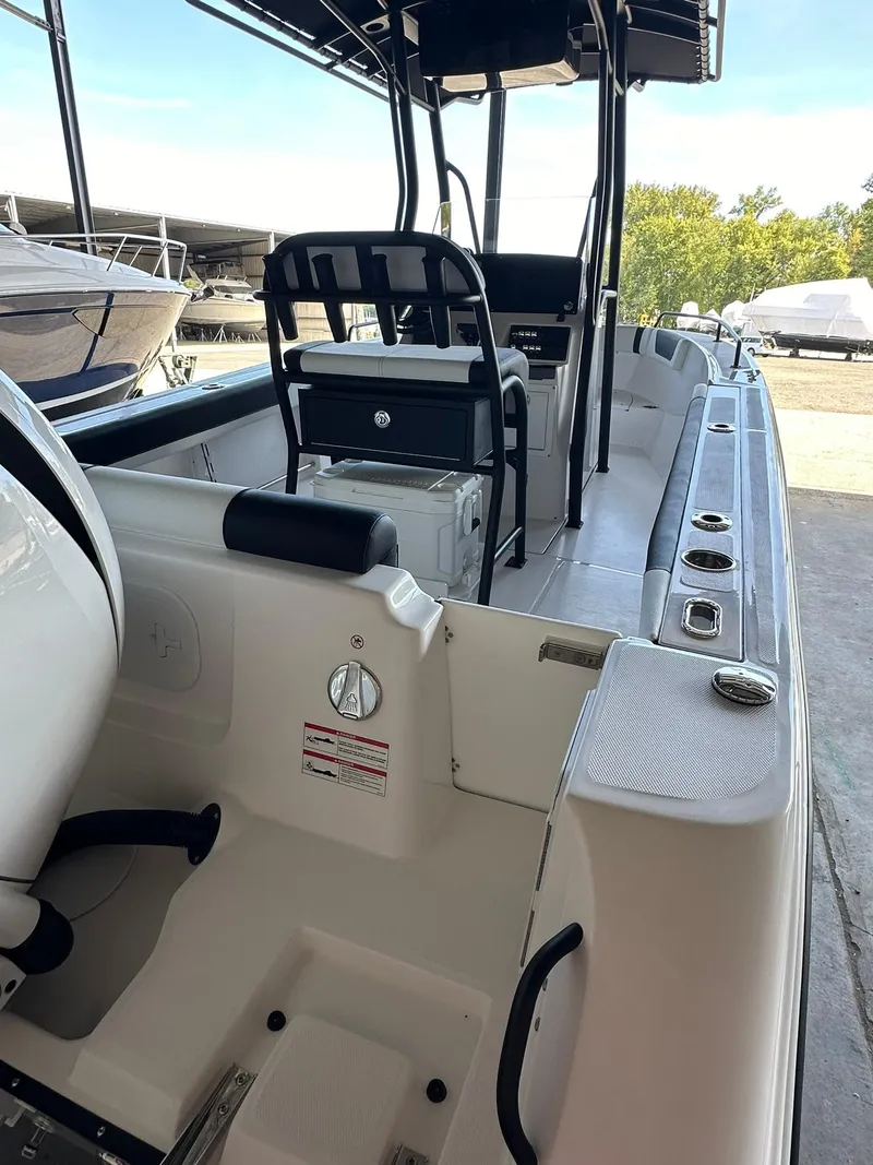 Slide: The Image of 2025 Edgewater 208CC Center Console boat, sleek design, spacious deck, modern features. - 8