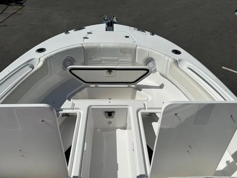 Slide: The Image of 2025 Edgewater 248CX Crossover boat interior with open storage compartments. - 29