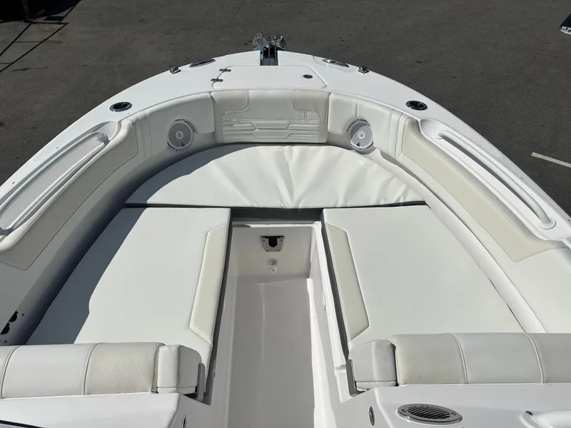 Slide: The Image of 2025 Edgewater 248CX Crossover boat with spacious white seating area. - 30