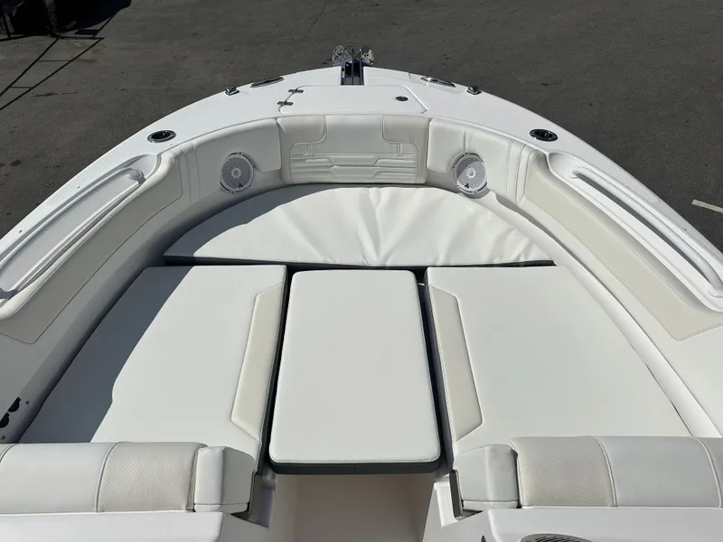 Slide: The Image of 2025 Edgewater 248CX Crossover boat with spacious white seating area. - 31