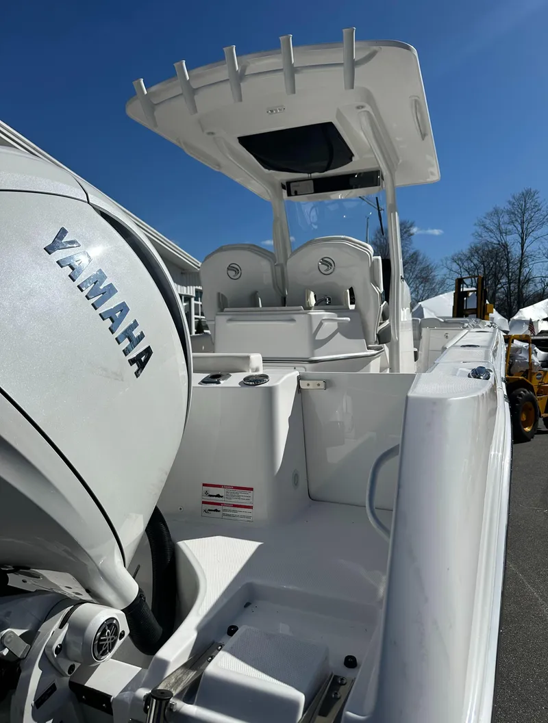 Slide: The Image of 2025 Edgewater 262 Center Console boat with Yamaha engine, viewed from the rear deck. - 10