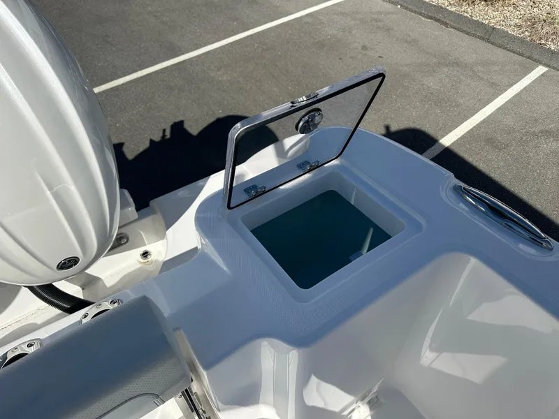 Slide: The Image of 2025 Edgewater 262 Center Console boat with open storage compartment. - 17