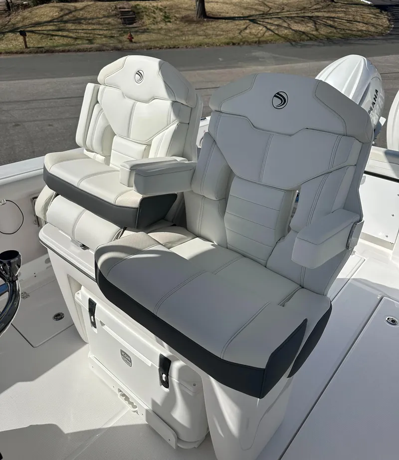 Slide: The Image of 2025 Edgewater 262 Center Console boat seats, featuring luxurious white upholstery and ergonomic design. - 23