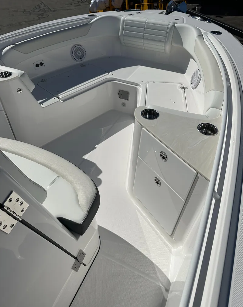 Slide: The Image of 2025 Edgewater 262 Center Console boat interior with seating and storage compartments. - 28