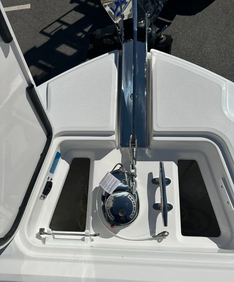 Slide: The Image of 2025 Edgewater 262 Center Console boat anchor compartment with stainless steel fittings. - 37