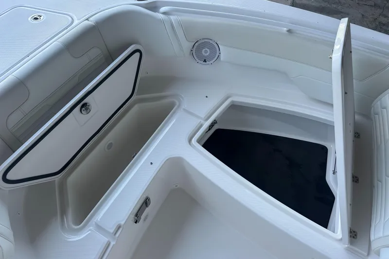 Slide: The Image of 2026 Edgewater 262CX Crossover boat storage compartments, open and spacious design. - 33