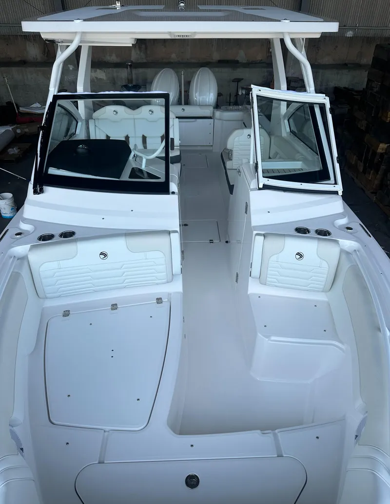 Slide: The Image of 2026 Edgewater 262CX Crossover boat interior with seating and open deck layout. - 35