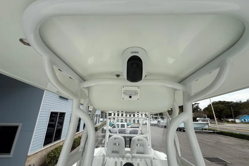 Slide: The Image of 2007 Yellowfin 34 Offshore boat interior with white seating and overhead structure. - 15