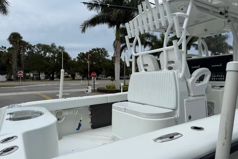 Slide: The Image of 2007 Yellowfin 34 Offshore boat with Garmin equipment, palm trees in background. - 12