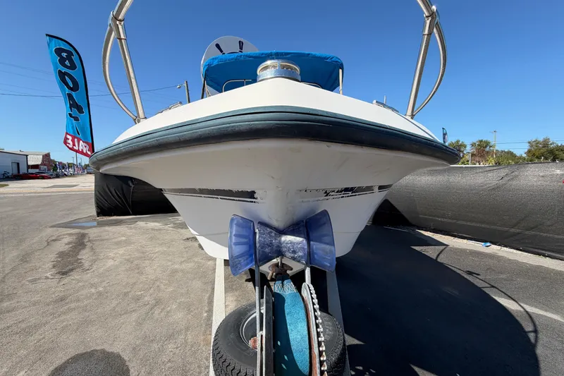 Slide: The Image of 1991 Grady-White Spirit 175 boat on trailer, displayed for sale under clear blue sky. - 11
