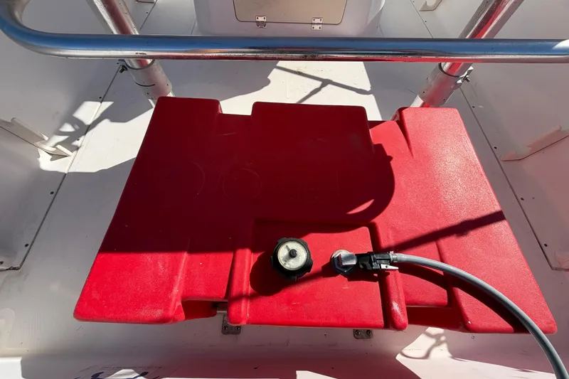 Slide: The Image of Red fuel tank on 1991 Grady-White Spirit 175 boat deck. - 15
