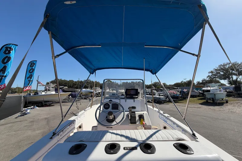 Slide: The Image of 1991 Grady-White Spirit 175 boat with blue canopy at a sale event. - 17