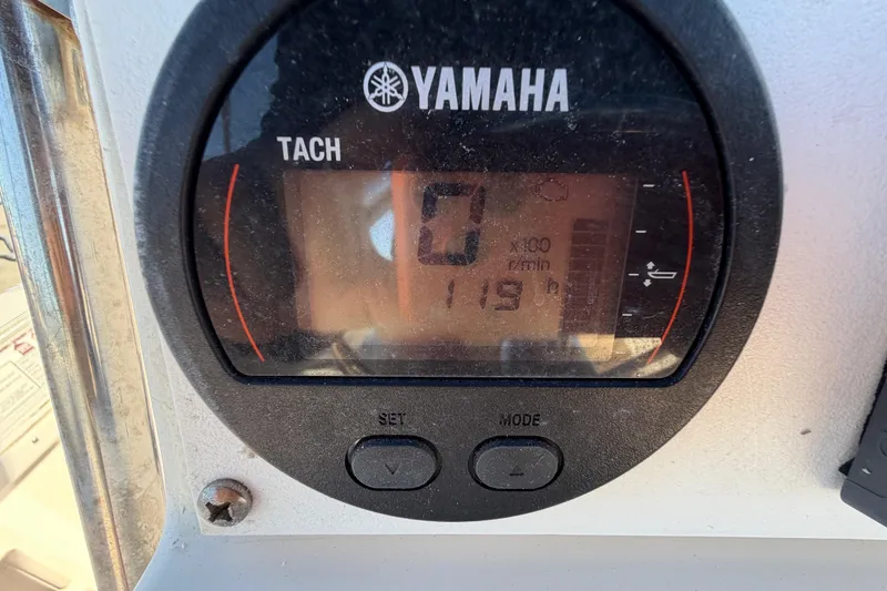 Slide: The Image of Yamaha tachometer on 1991 Grady-White Spirit 175 boat, displaying 119 hours. - 19