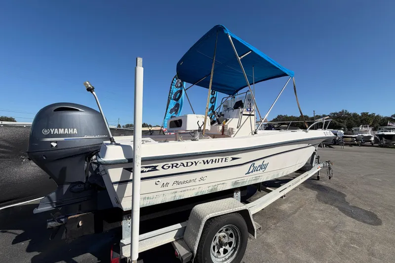 Slide: The Image of 1991 Grady-White Spirit 175 boat with Yamaha motor on trailer, blue canopy. - 2