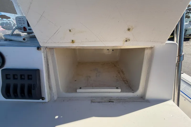 Slide: The Image of 1991 Grady-White Spirit 175 boat console storage compartment, open and empty. - 25