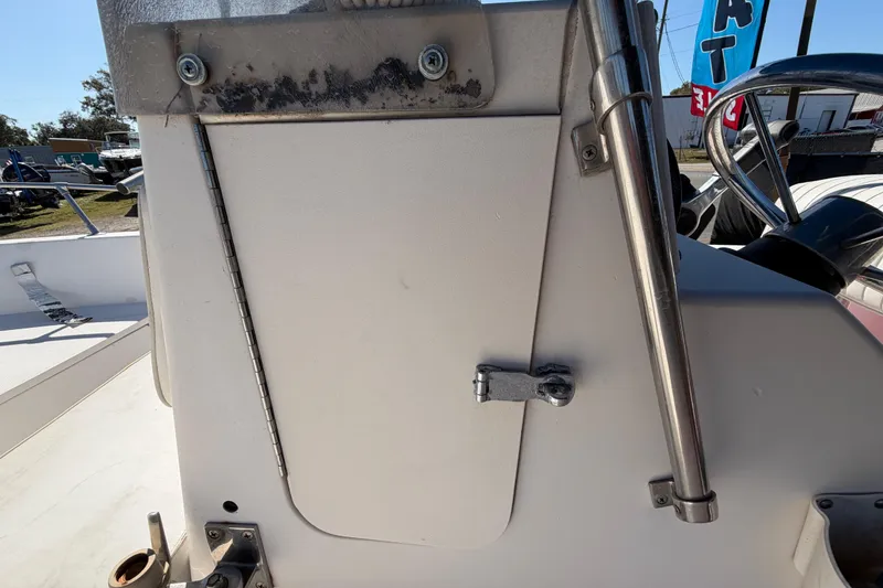 Slide: The Image of 1991 Grady-White Spirit 175 boat console with stainless steel fittings and steering wheel. - 31