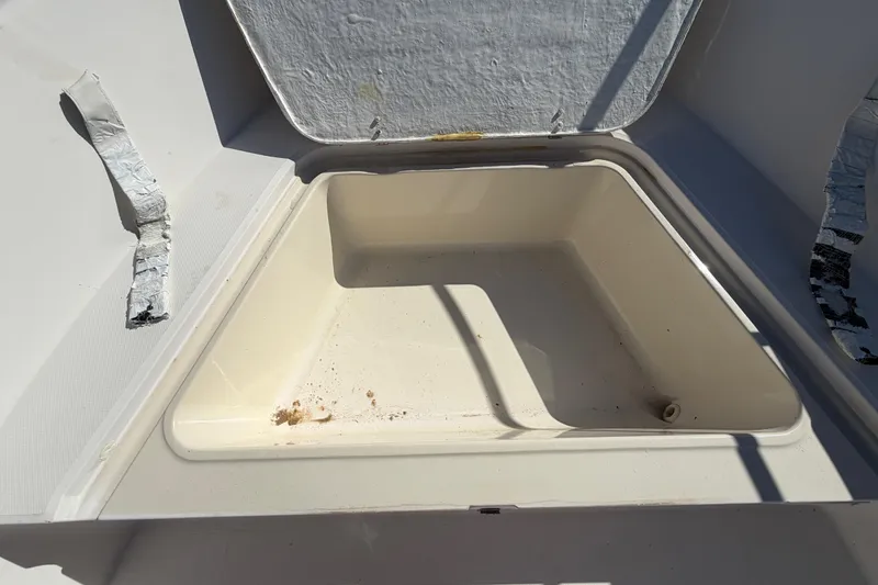 Slide: The Image of Open storage compartment on a 1991 Grady-White Spirit 175 boat. - 38