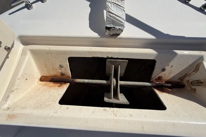 Slide: The Image of Anchor compartment of 1991 Grady-White Spirit 175 boat, showing rust and wear. - 41