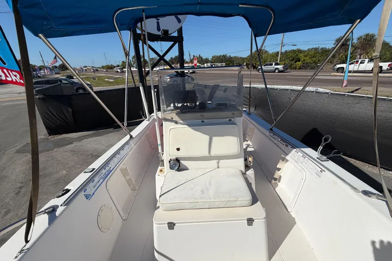 Slide: The Image of 1991 Grady-White Spirit 175 boat interior with blue canopy and central console. - 45