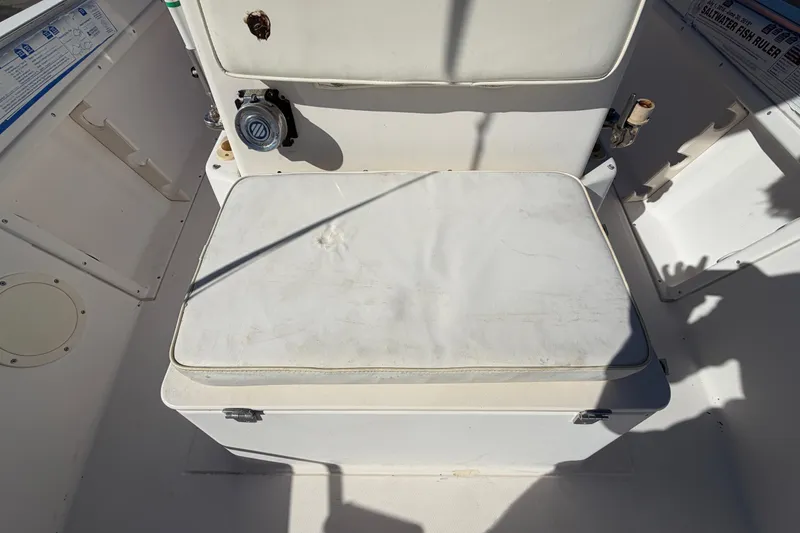 Slide: The Image of 1991 Grady-White Spirit 175 boat interior with cushioned seating and storage. - 46