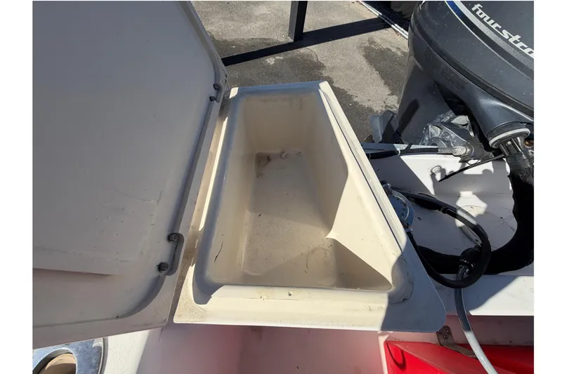 Slide: The Image of Open storage compartment on a 1991 Grady-White Spirit 175 boat. - 52