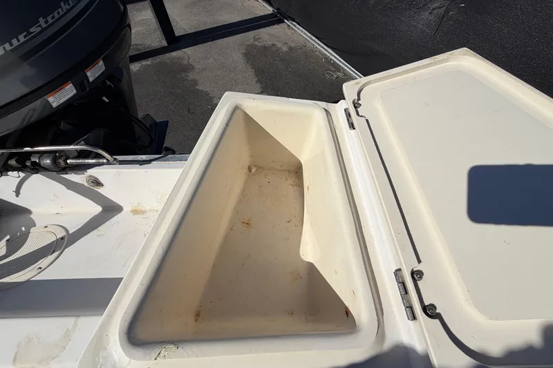 Slide: The Image of Open storage compartment on a 1991 Grady-White Spirit 175 boat. - 54