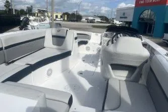 Slide: The Image of 2022 Hurricane SunDeck 192 OB boat interior with seating and steering console. - 6