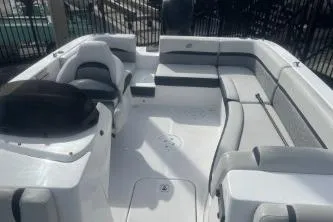 Slide: The Image of 2022 Hurricane SunDeck 192 OB boat interior with spacious seating and modern design. - 9